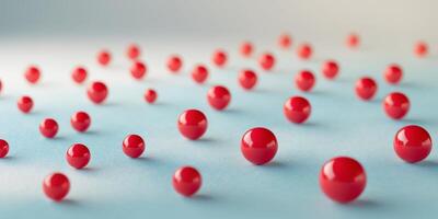 Scattered red glossy spheres on gradient surface. photo