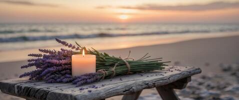 Relaxing sunset ambiance with candle and lavender by the sea. photo