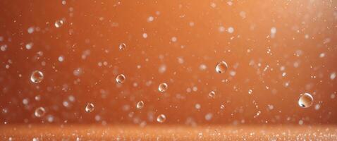Orange background with droplets of water. photo