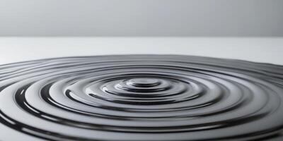 Dark Liquid Surface Showing Concentric Ripples photo