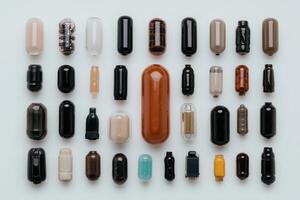 Collection of various capsule shaped objects arranged on a white background photo