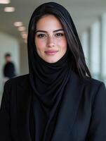 Confident businesswoman in hijab smiling photo