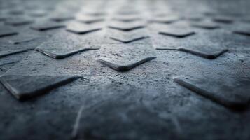 A close up of a black surface with a pattern of triangles photo