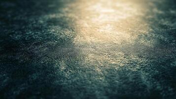 A blurry image of a wet surface with a dark blue background photo