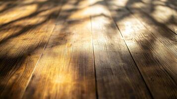 A wooden floor with a shadow of a tree on it photo