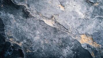 A grey and gold rock with a rough texture photo