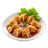 A plate of dumplings with sauce and lettuce png