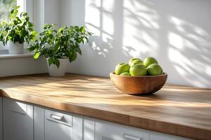 Green apples in wooden bowl sitting on butcher block kitchen countertop photo