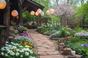 Cozy backyard garden with stone pathway and hanging lanterns illuminating spring flowers photo