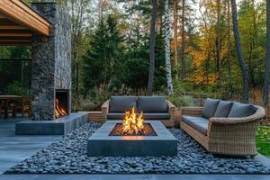 Burning fire pit warming up cozy patio in autumn forest photo