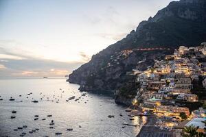 Night view over Positano town and beach in Amalfi coast in Italy photo