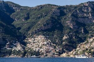 Positano village and cliff rock along photo
