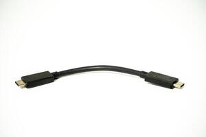 USB cable connecting devices in a tech workspace setup photo
