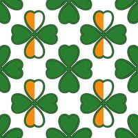 Elegant shamrocks and Irish flags seamless tile pattern with rich green and orange hues vector
