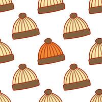 Cozy autumn knit hats seamless tile pattern with warm colors and textured details vector