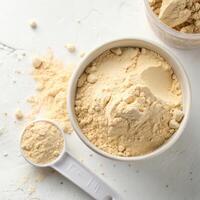 Top View of Protein Powder in a Bowl on a White Background photo