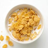 Top View of Cornflakes in a Bowl on a White Background photo