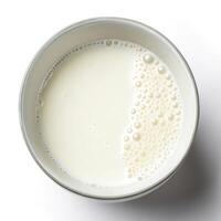 Top View of a Bowl of Milk on a White Background photo