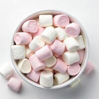Top View of Mini Marshmallows in a Bowl on a White Background photo