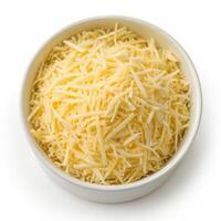 Top View of Grated Cheese in a Bowl on a White Background photo