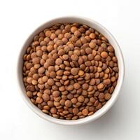 Top View of Cooked Lentils in a Bowl on a White Background photo