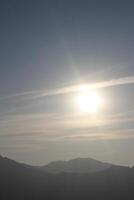 A person flying a kite in the sky photo