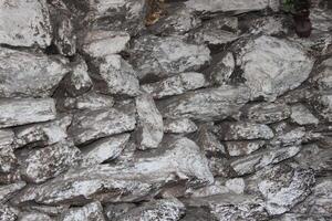 A wall with a large rock formation in it photo