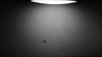 photo of a wall lit from above and producing a silhouette effect