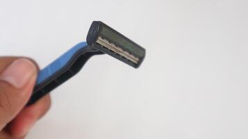 a photo of a mustache trimmer being held