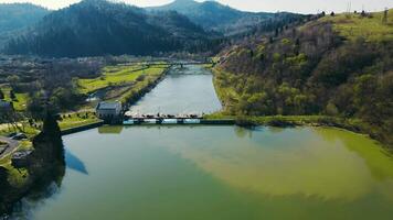 Aerial view small dam on the river. A small power plant of local significance. video