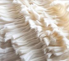 Ethereal textures weave a tapestry of soft white fur, creating a mesmerizing play of light and shadow photo