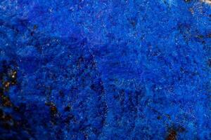 Macro Azurite mineral stone with Pyrite inserts on a white background close up photo