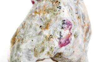 Macro mineral stone Ruby in rock on white background close up photo