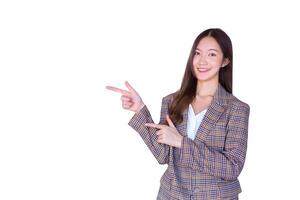 Asian professional female with black long hair wearing plaid suit and pretty smiling looking at camera is present product while isolated white background. photo