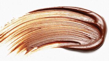 Metallic bronze curved stroke with shimmering highlights and bold texture. photo