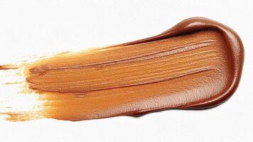 Bronze paint smear with metallic sheen and textured rough finish. photo
