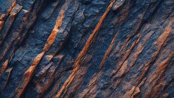 Rust-colored stone surface with sharp, angular cracks, showcasing unique geological formations and textures for abstract stone backgrounds and architectural design inspiration photo