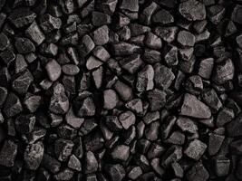 Natural abstract black stone texture providing a unique background for design projects photo