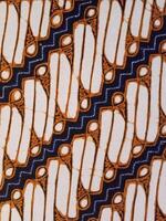 Batik pattern background. A close up of Javanese batik with a Parang Srimpi pattern. Indonesian batik photo