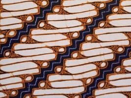 Batik pattern background. A close up of Javanese batik with a Parang Srimpi pattern. Indonesian batik. photo