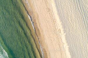 directly above view of beach with vibrant turquoise water, aerial drone view concept tranquility background photo