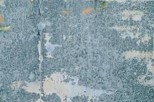 detail of a sheet metal door weathered, textured background for design photo