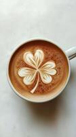 Cup of coffee with leaf clover latte art, good luck and celebrating St. Patrick's Day photo