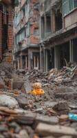A child toy among rubble and debris of a collapsed building, symbolizing destruction and loss photo