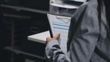 A person holding a clipboard with a list of items video