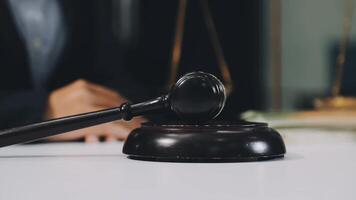 Judge's gavel on table with scales and money video