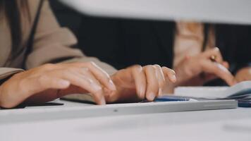 Two people typing on a computer keyboard video