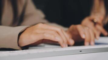 Close up of hands typing on a keyboard video