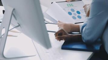 A person is looking at a computer screen with a business plan video