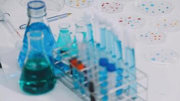 A laboratory table with several test tubes and other items video